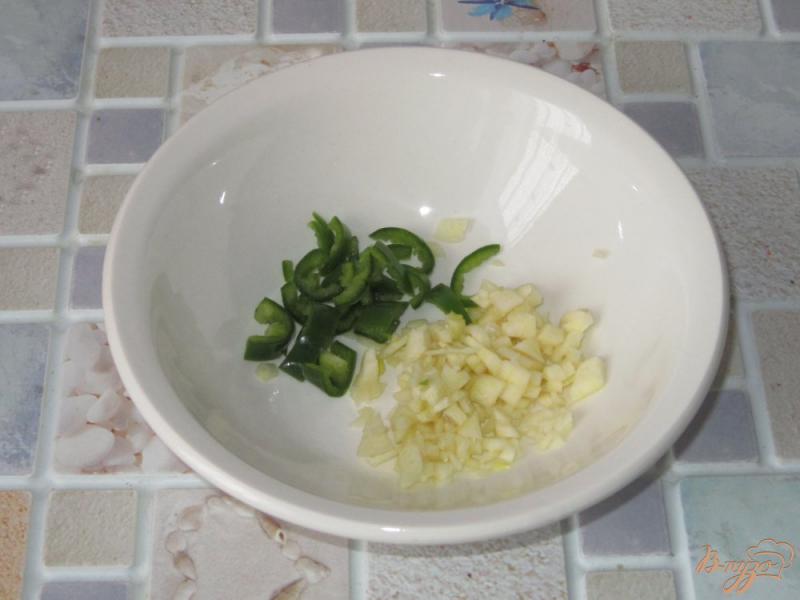Фото приготовление рецепта: Ребрышки запеченные  в фольге шаг №3