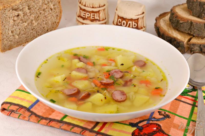 Фото приготовление рецепта: Суп с рисом и егерскими колбасками шаг №8