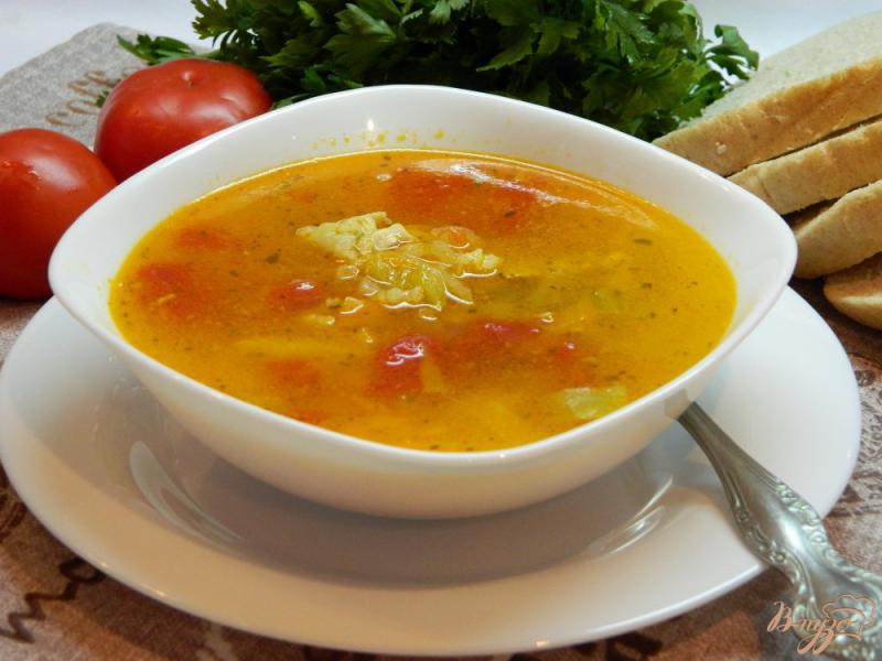 Фото приготовление рецепта: Рисовый суп с помидорами шаг №7