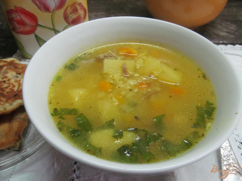 Фото приготовление рецепта: Суп с рисом и тыквой на утином бульоне шаг №6