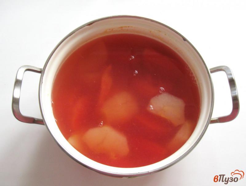 Фото приготовление рецепта: Компот из красного грейпфрута и яблок шаг №4