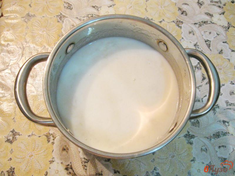 Фото приготовление рецепта: Сладкая рисовая каша с изюмом шаг №4