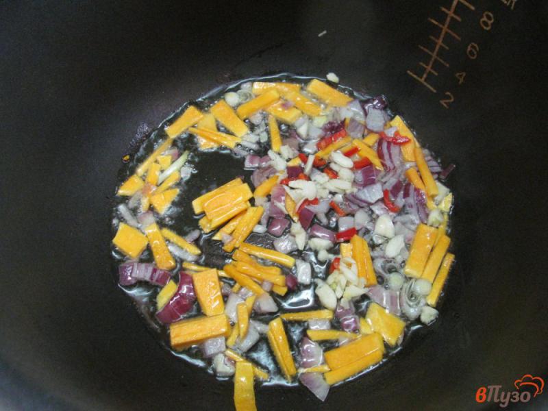 Фото приготовление рецепта: Рис с тыквой в мультиварке шаг №2
