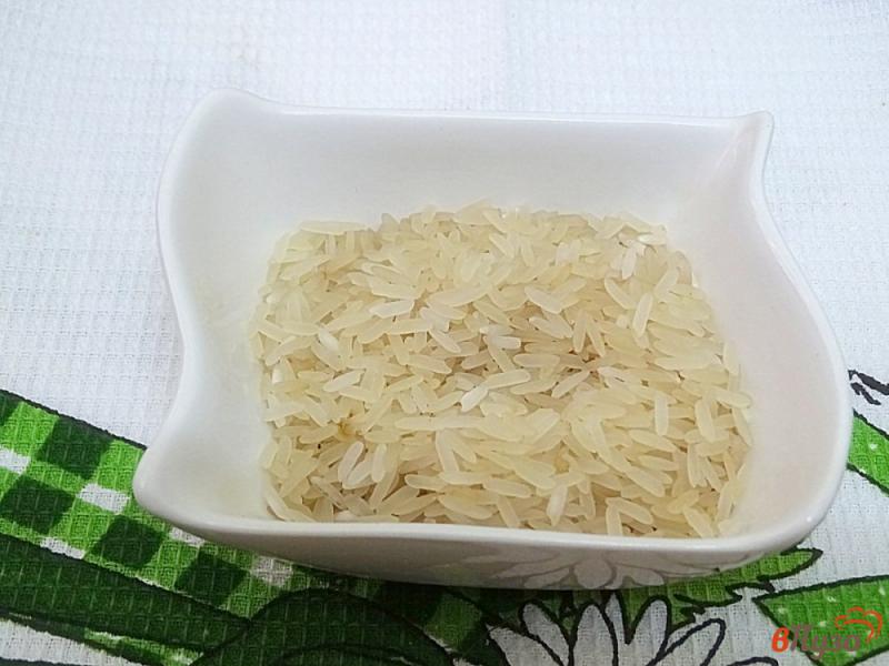 Фото приготовление рецепта: Рассольник с рисом и огурцами шаг №2