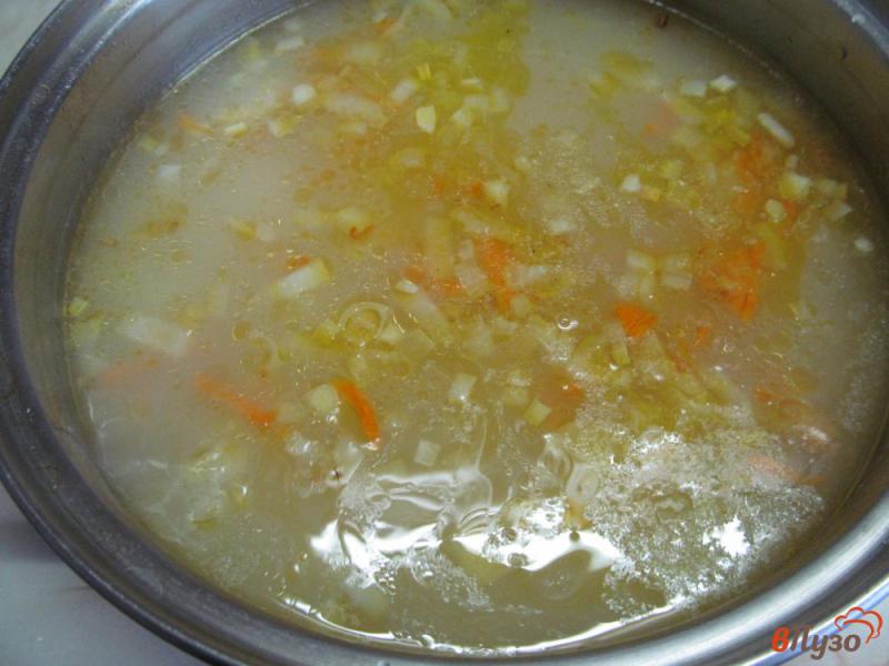 Фото приготовление рецепта: Суп из квашеной капустой и пшеном шаг №6