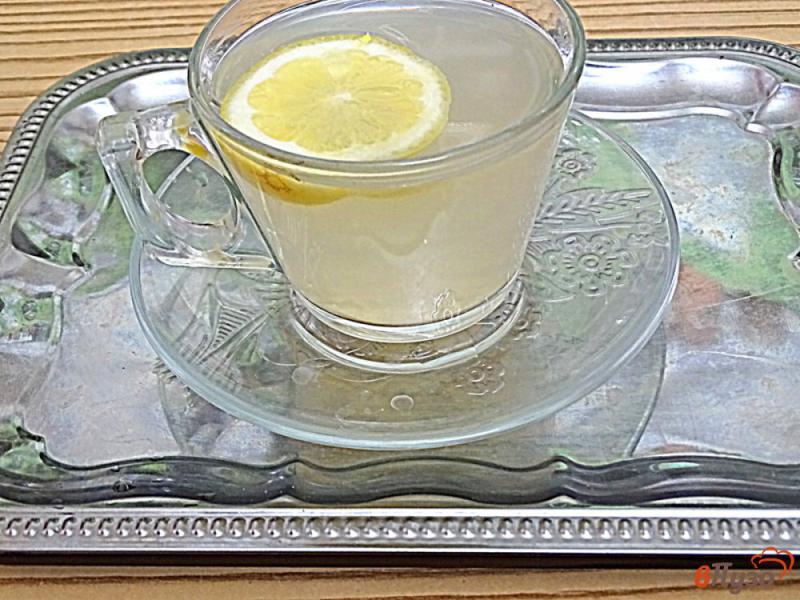Фото приготовление рецепта: Имбирный чай с кардамоном и лимоном шаг №9